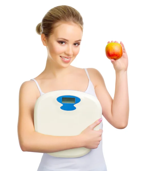 Young healthy girl with scales and apple — Stock Photo, Image