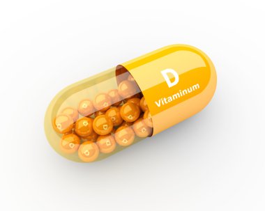 Masanın üzerinde yatan D vitamini kapsülü