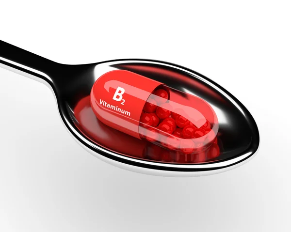 3D B2-vitamin tabletta a kanállal a fehér — Stock Fotó