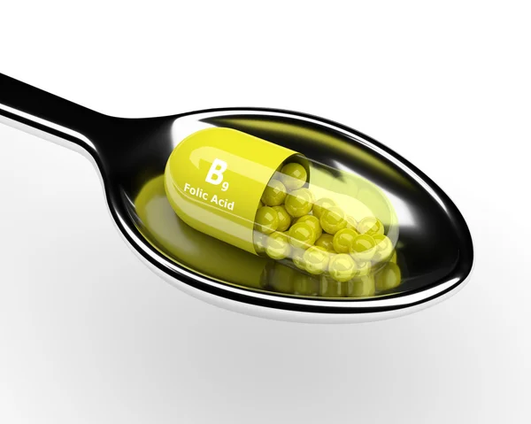 3d vitamina B9 pílula na colher sobre branco — Fotografia de Stock