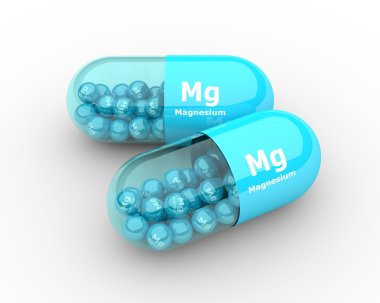 magnesium capsule with granules lying on table clipart