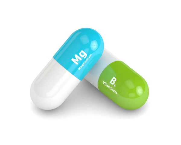 3D-rendering av magnesium nad vitaminum B6 piller över vita backg — Stockfoto