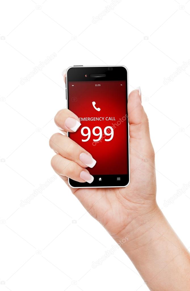 hand holding mobile phone with emergency number 999