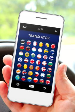hand holding mobile phone with language translator application clipart