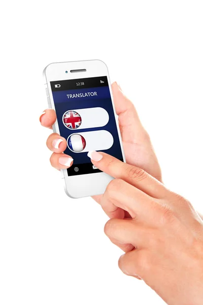 Руки держат мобильный телефон с приложением переводчика языка — стоковое фото
