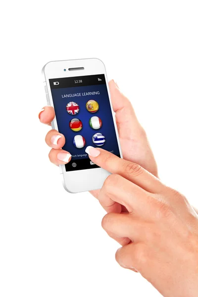 Hand holding mobile phone with language learning application ove — Stock Photo, Image