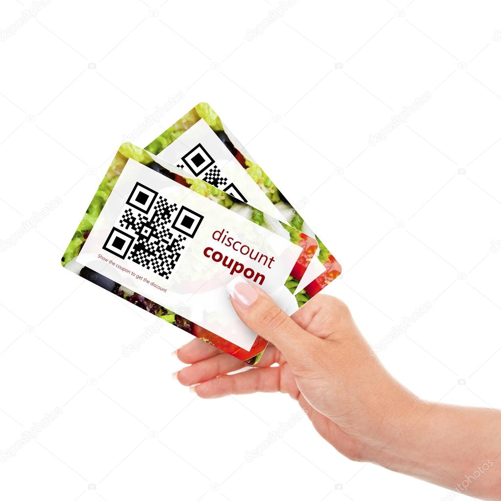 hand holding two  discount coupons with qr code isolated over wh