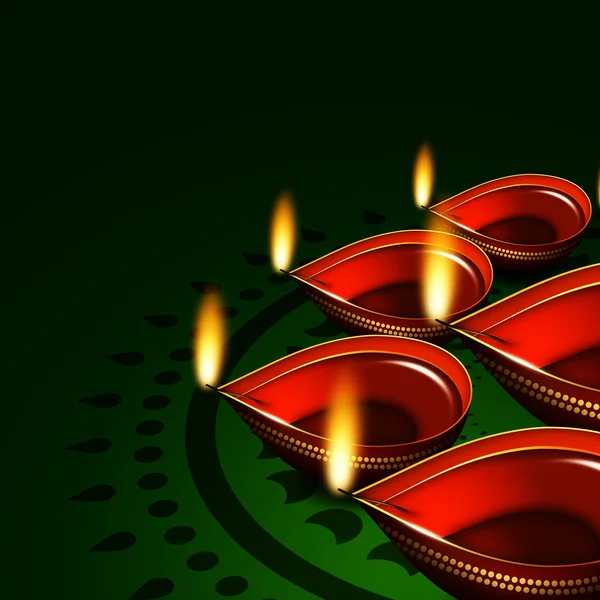 Diwali oil lamps over green background — Stock Photo, Image