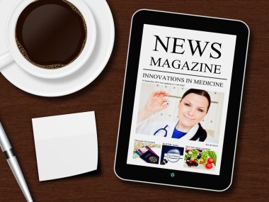 Tablet ile haber dergisi, fincan kahve, kalem ve beyaz sayfa