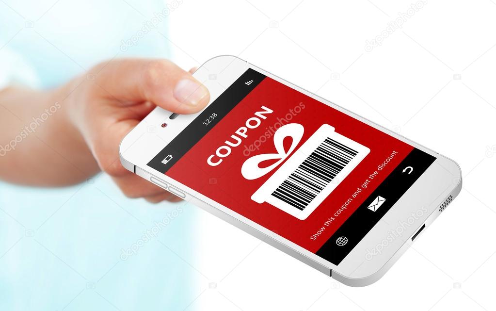 hand holding mobile phone with christmas coupon over white