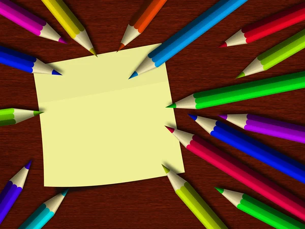 Colour pennor ligger på trä skrivbord med anmärkning — Stockfoto