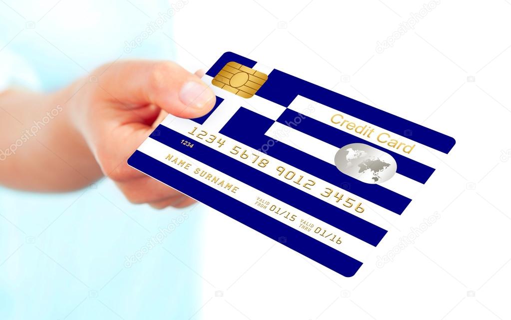 greek credit card holded by hand isolated over white