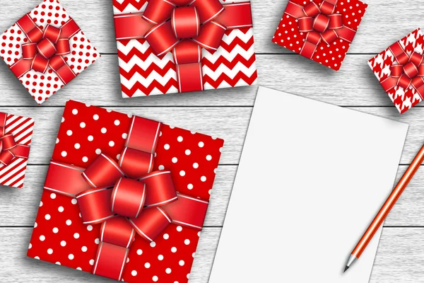 Weihnachtsgeschenke mit leeren Papier und Bleistift — Stockfoto