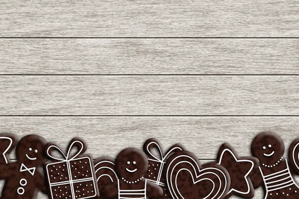 Рождественские пряники лежат на деревянном столе — стоковое фото