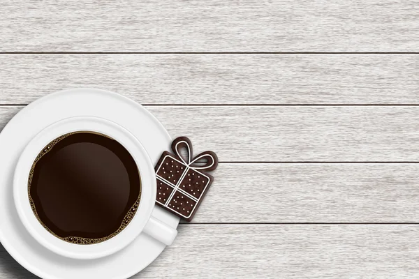 Tazza di caffè e pan di zenzero regalo sdraiato sulla scrivania di legno — Foto Stock