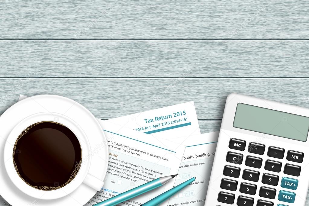 UK tax form with calculator, coffee lying on wooden desk 