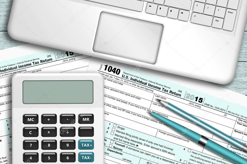 Calculator with tax form 1040 lying on wooden desk Stock Photo by