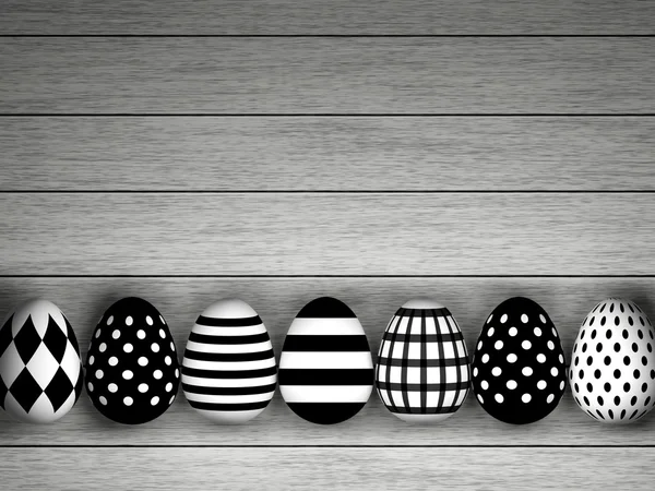 Black and white Easter eggs lying on desk — Stock Photo, Image