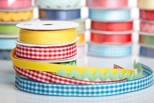 Colorful ribbon rolls on white — Stock Photo, Image