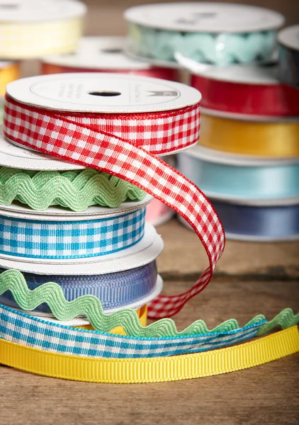 Colorful ribbon rolls on white — Stock Photo, Image