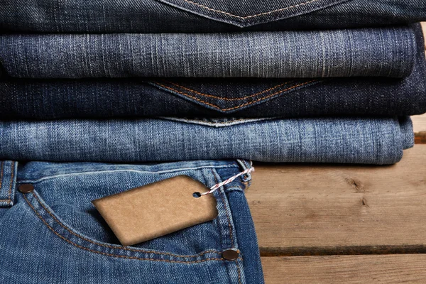 Blue jeans textura y etiqueta de precio — Foto de Stock