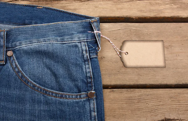 Blå jeans struktur och prislapp — Stockfoto