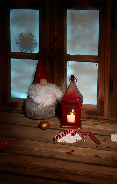 Frosted window with Christmas decoration — Stock Photo, Image