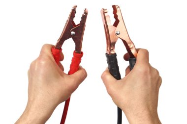 Hands with jumper cables on white clipart