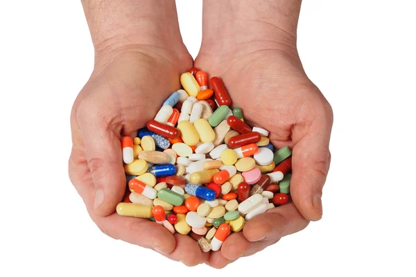 Manos con pastillas — Foto de Stock