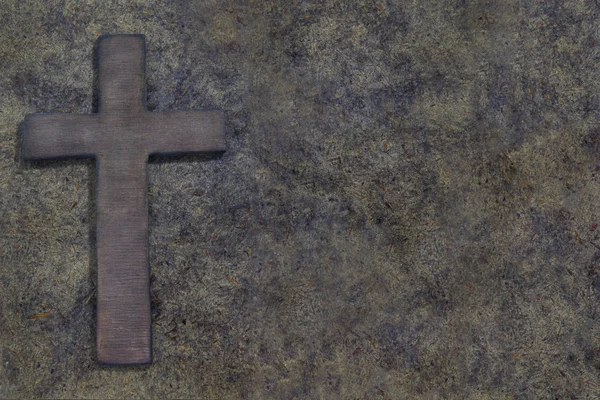 Wooden cross on old wooden board — Stock Photo, Image