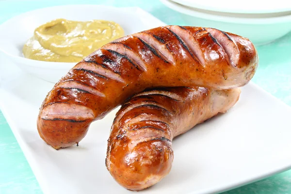 Fried sausage on white plate Stock Image