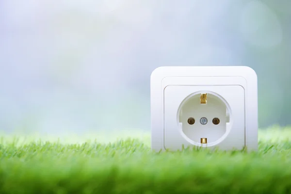 Electric outlet in the grass — Stock Photo, Image