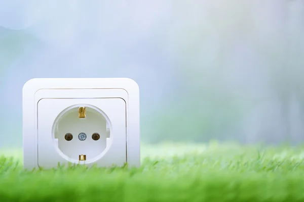 Electric outlet in the grass — Stock Photo, Image