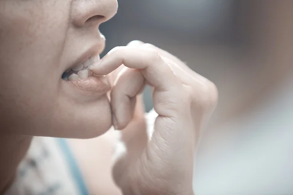 Nail biting. Close-up view — Stock Photo, Image