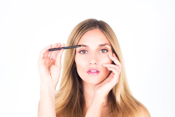 Woman paints her eyebrows. make up — Stock Photo, Image