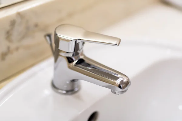 Shiny stainless steel faucet with chrome water tap — Stock Photo, Image