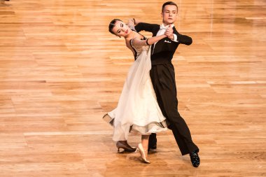 Competitors dancing slow waltz or tango clipart