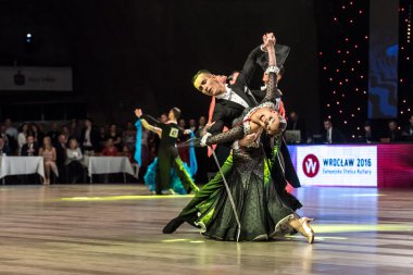 Wroclaw, Poland - May 14, 2016: Linis Edgars and Eliza Ancane in dance pose during World Dance Sport Federation European Championship Standard Dance, on May 14 in Wroclaw, Poland
