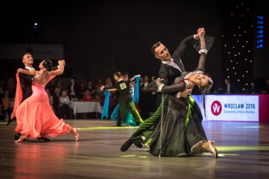 Wroclaw, Poland - May 14, 2016: Linis Edgars and Eliza Ancane in dance pose during World Dance Sport Federation European Championship Standard Dance, on May 14 in Wroclaw, Poland