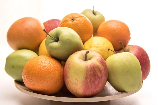 Tasty fruit orange, apples and banana on the wooden plate — Stock Photo, Image