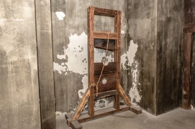 guillotine in the museum of torture clipart