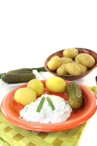 Potatoes with curd, pickles and chives Royalty Free Stock Images