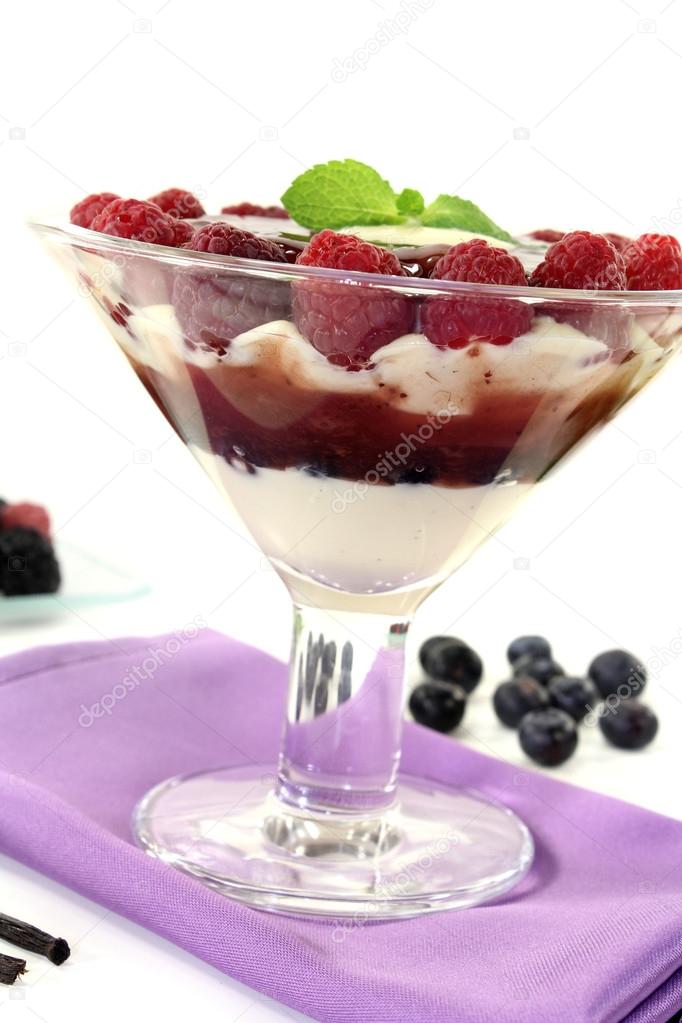 Layered dessert with raspberries