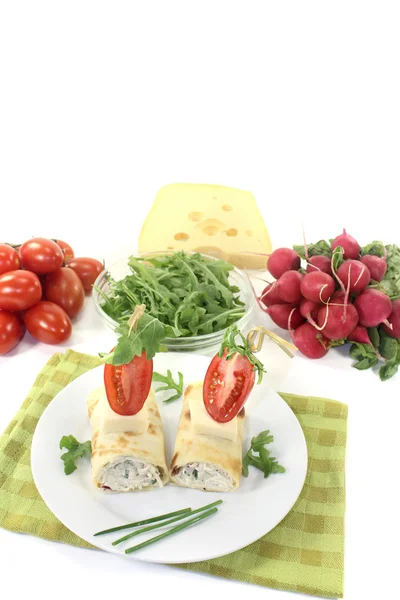 Stuffed cheese crepe rolls with arugula — Stock Photo, Image