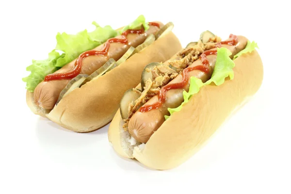 Cachorros-quentes com ketchup e cebolas fritas — Fotografia de Stock