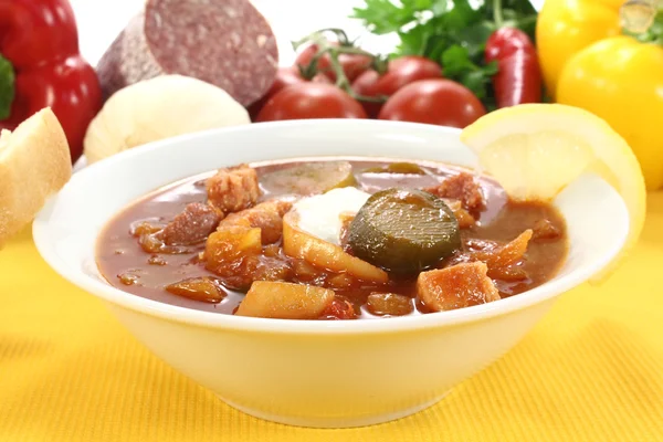 Soljanka in a soup bowl with pickles — Stock Photo, Image