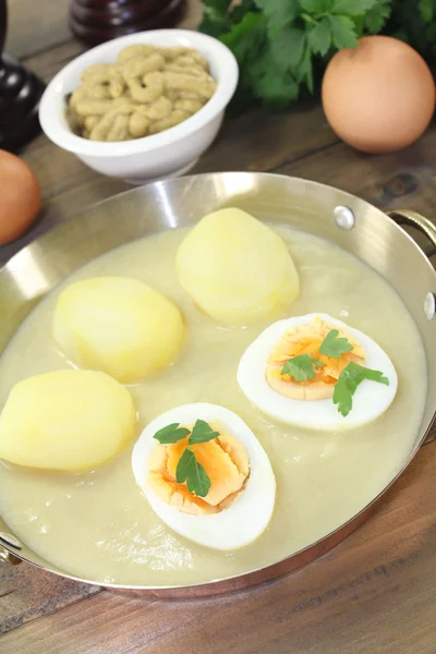 Sharp mustard eggs with sauce and potatoes — Stock Photo, Image