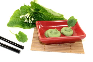 Wasabi with Chopsticks, leaves and blossoms clipart