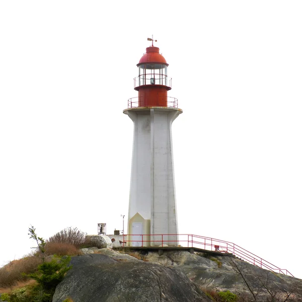 Lighthouse building on rock — Stock Photo, Image