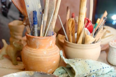 Handmade old clay pots with pencils clipart